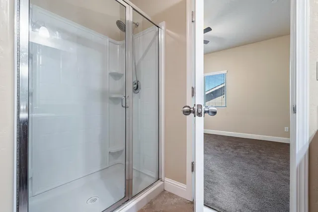 a view of walk in closet with washer and dryer