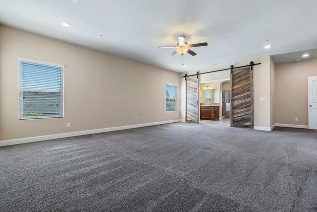 a bathroom with a granite countertop sink and a bathtub