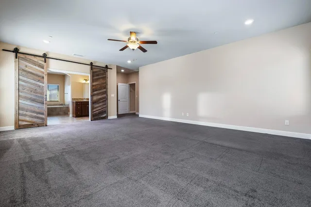 a bath tub sitting next to a shower