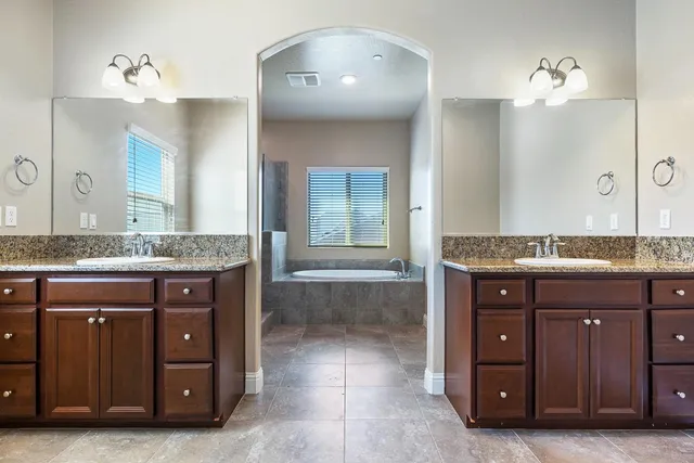 a view of a house with wooden fence
