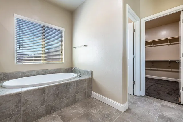a view of a backyard with a sink and wooden fence
