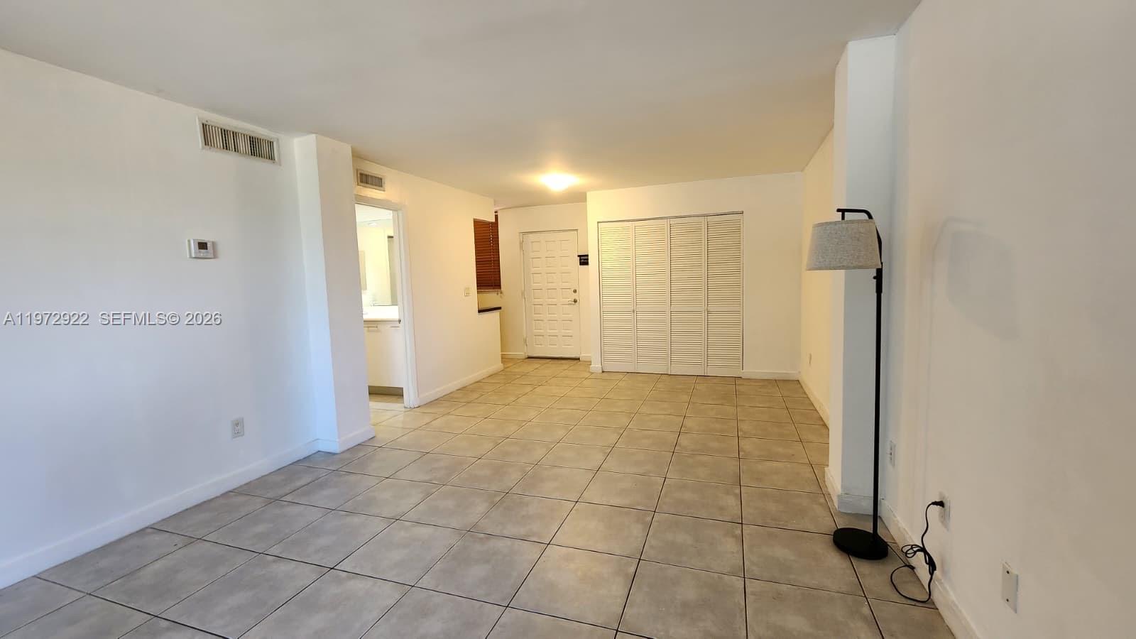 680 Northeast 64th Street, Unit A215 Miami, FL 33138 - Photo 15 of 24 a view of empty room