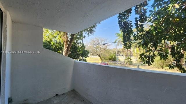 680 Northeast 64th Street, Unit A215 Miami, FL 33138 - Photo 16 of 24 a view of a bunch of plants and a tree