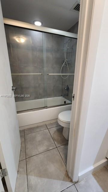 680 Northeast 64th Street, Unit A215 Miami, FL 33138 - Photo 21 of 24 a bathroom with a toilet and a shower