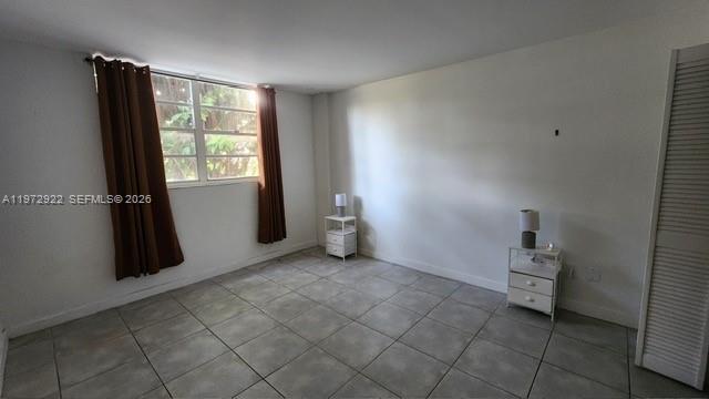 680 Northeast 64th Street, Unit A215 Miami, FL 33138 - Photo 22 of 24 a view of empty room with closet