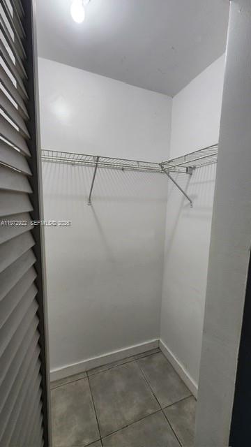 680 Northeast 64th Street, Unit A215 Miami, FL 33138 - Photo 23 of 24 a view of a room with racks on the wall