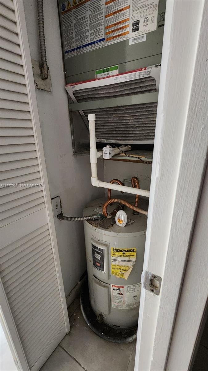 680 Northeast 64th Street, Unit A215 Miami, FL 33138 - Photo 24 of 24 a utility room with washer and dryer