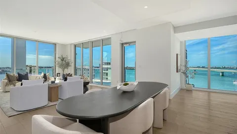a living room with kitchen island furniture and a large window