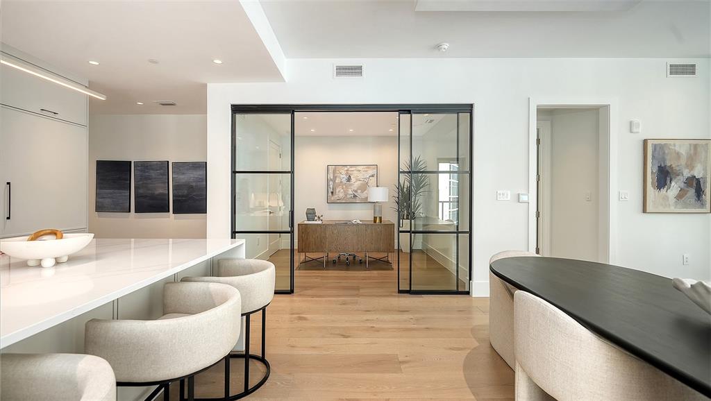 253 Golden Gate Point, Unit 703 Sarasota, FL 34236 - Photo 19 of 51 a living room with furniture and a large window