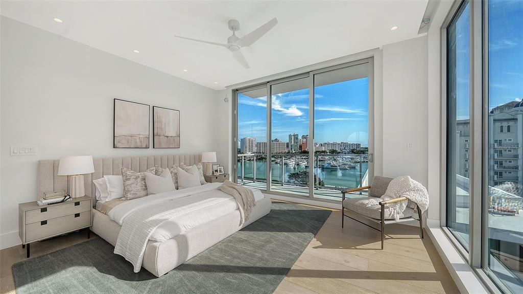 253 Golden Gate Point, Unit 703 Sarasota, FL 34236 - Photo 22 of 51 a living room with furniture and a large window