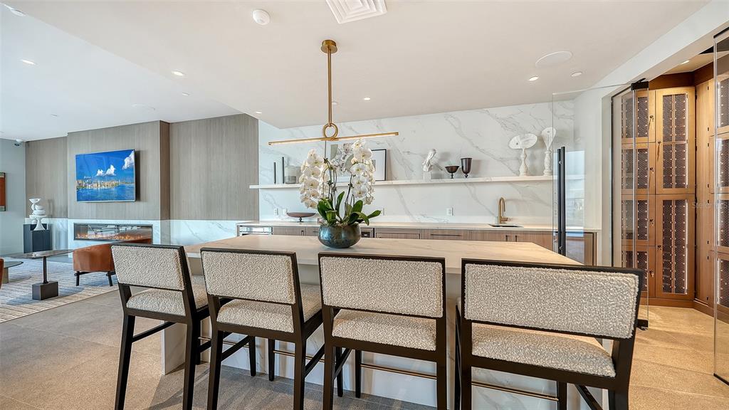253 Golden Gate Point, Unit 703 Sarasota, FL 34236 - Photo 49 of 51 a dining room with furniture and window