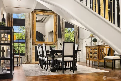 a view of a dining room with furniture window and wooden floor