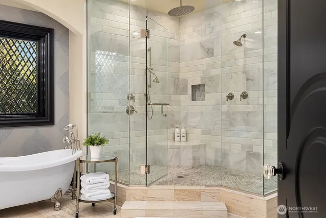 a bathroom with a bathtub and shower