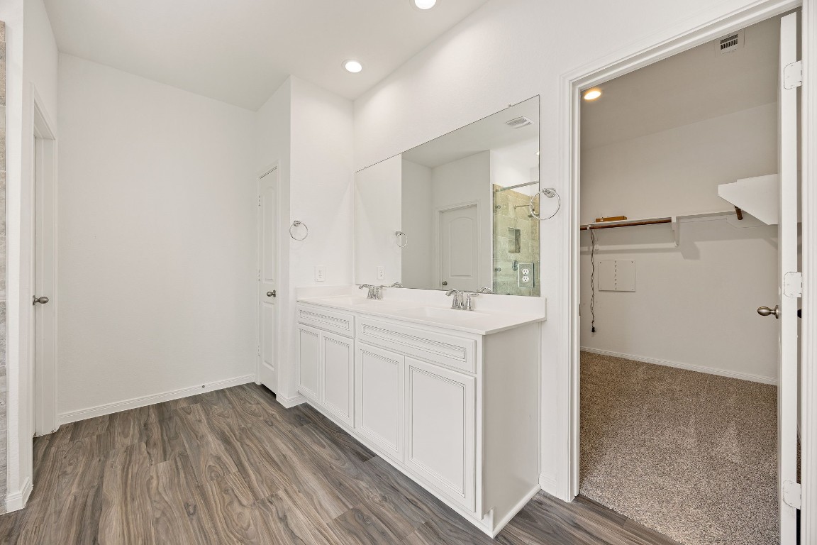 907 Youth Water Road Montgomery, TX 77316 - Photo 11 of 31 a bathroom with a sink and a mirror