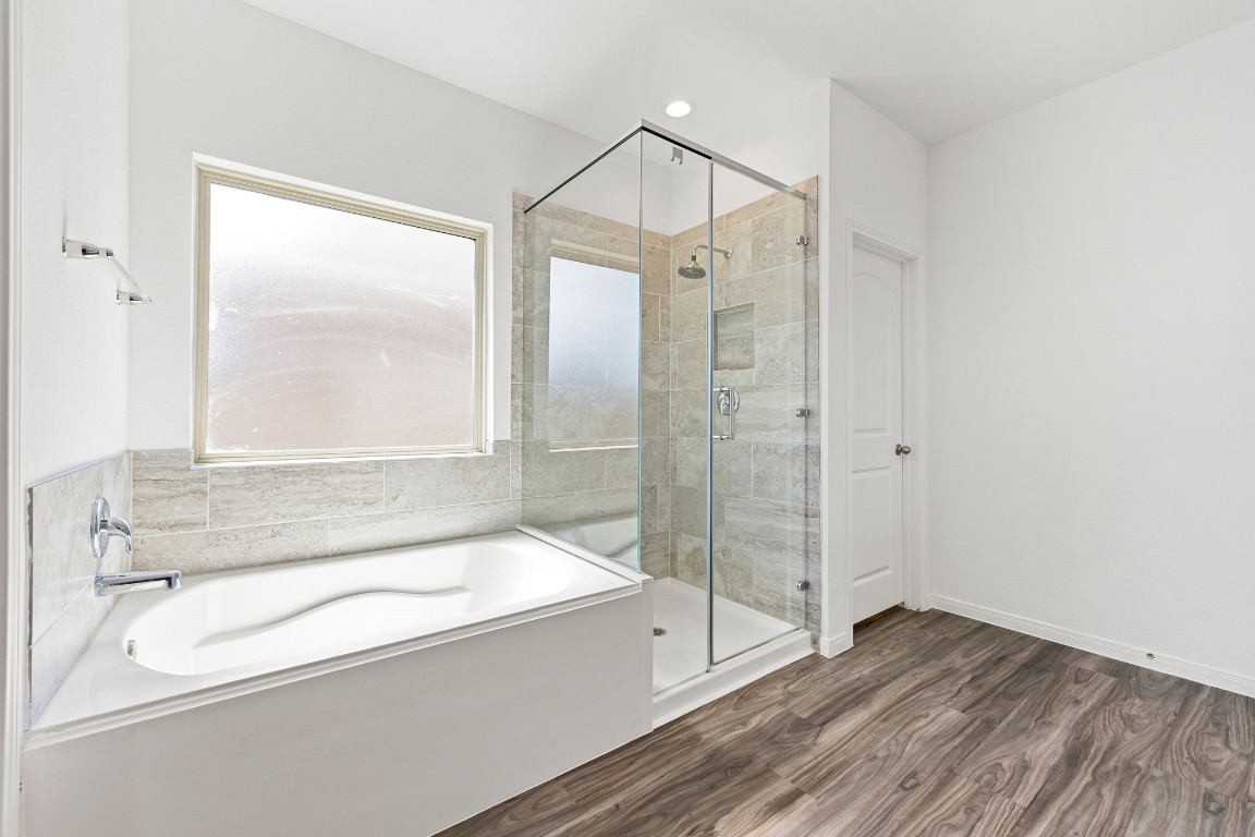 907 Youth Water Road Montgomery, TX 77316 - Photo 12 of 31 a bathroom with a bathtub and a shower