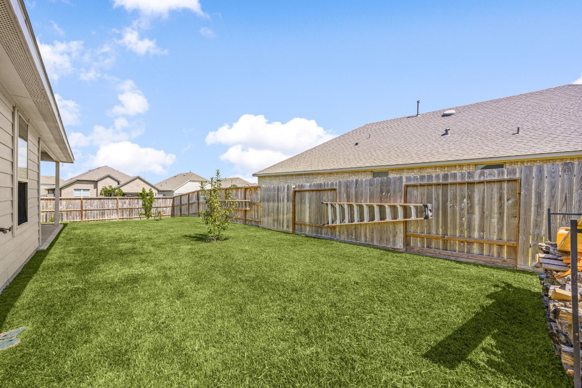 907 Youth Water Road Montgomery, TX 77316 - Photo 22 of 31 a view of a house with backyard and porch