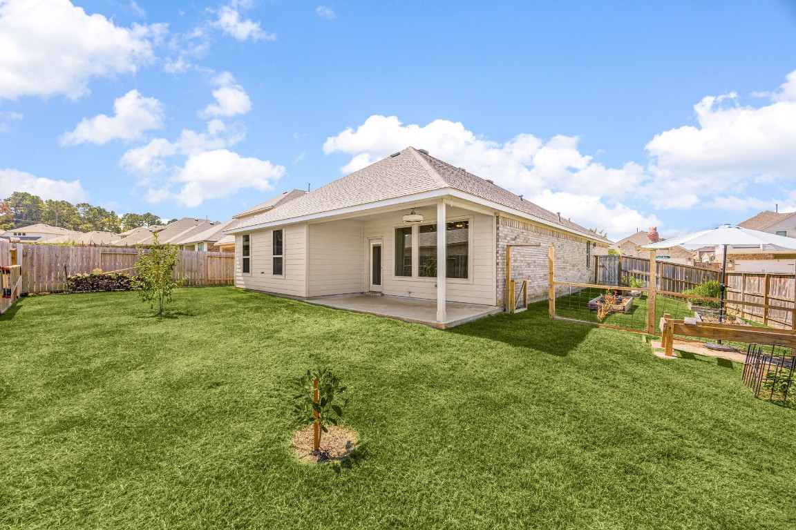 907 Youth Water Road Montgomery, TX 77316 - Photo 23 of 31 a view of a house with a backyard