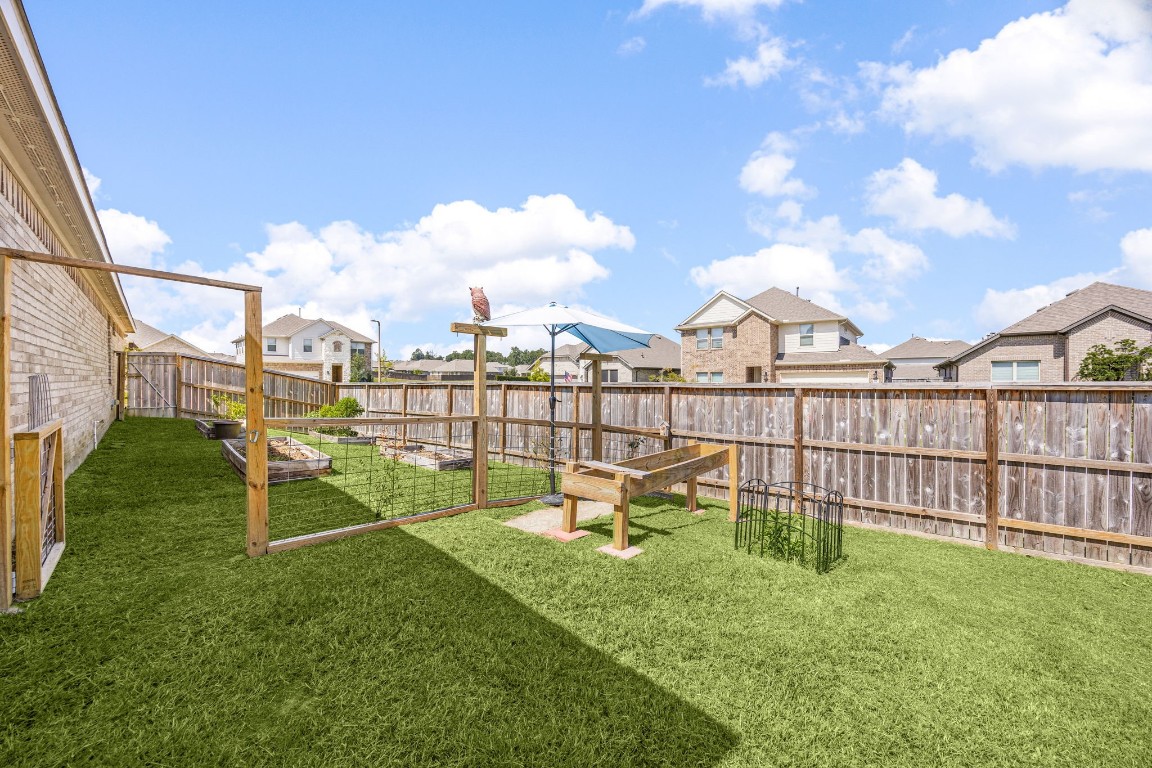 907 Youth Water Road Montgomery, TX 77316 - Photo 24 of 31 a view of a house with a backyard and a bench