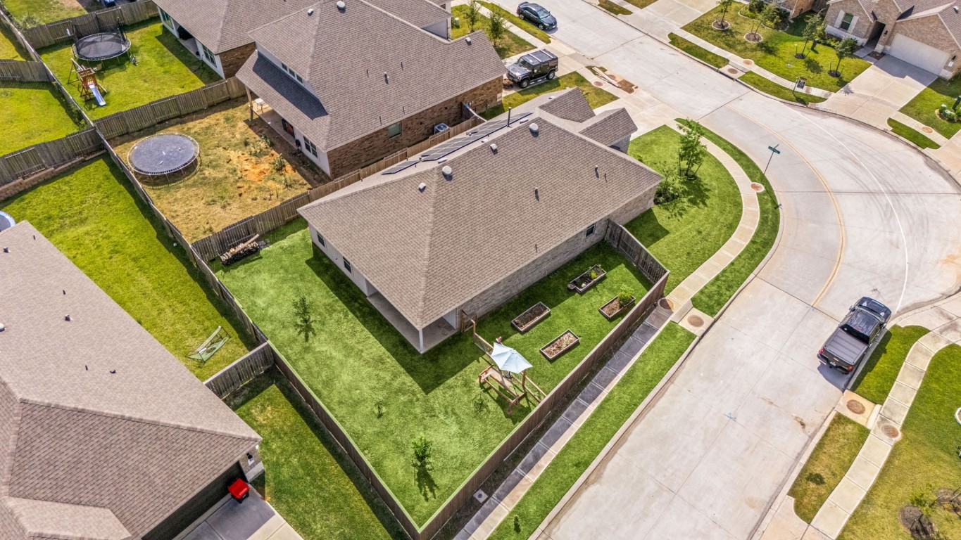 907 Youth Water Road Montgomery, TX 77316 - Photo 27 of 31 an aerial view of a house with a garden and swimming pool