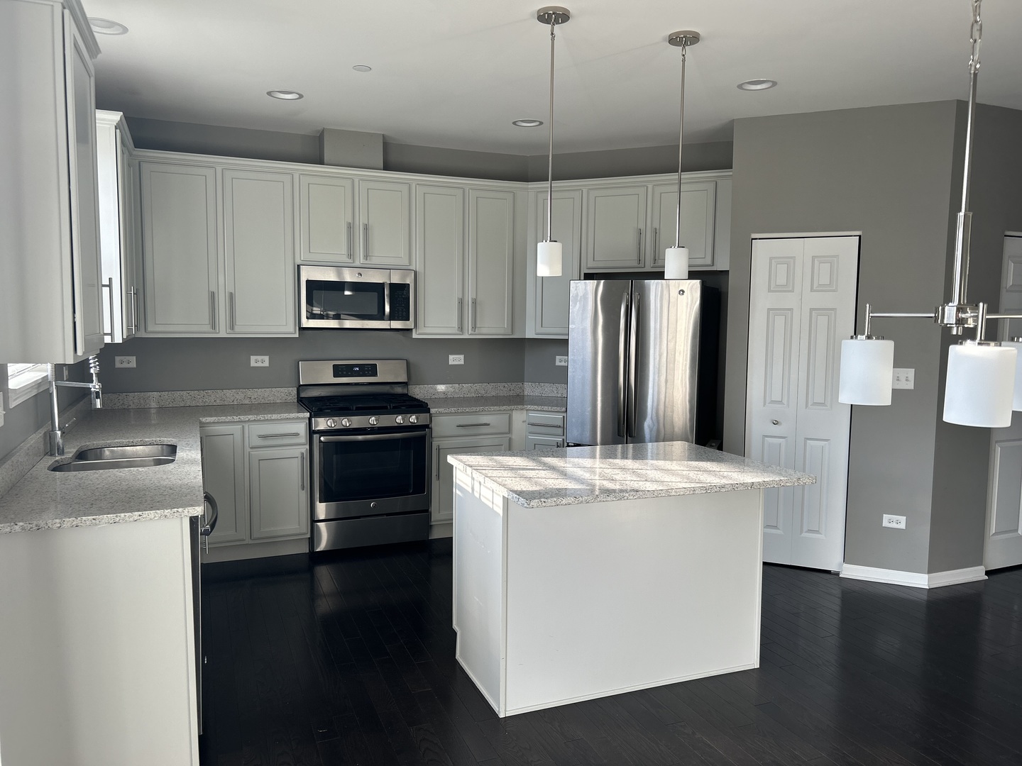 2953 Madison Drive, Unit 2953 Naperville, IL 60564 - Photo 2 of 18 a kitchen with a stove a refrigerator and a sink