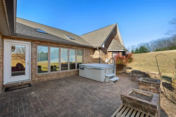 a view of a house with a yard and mountain view