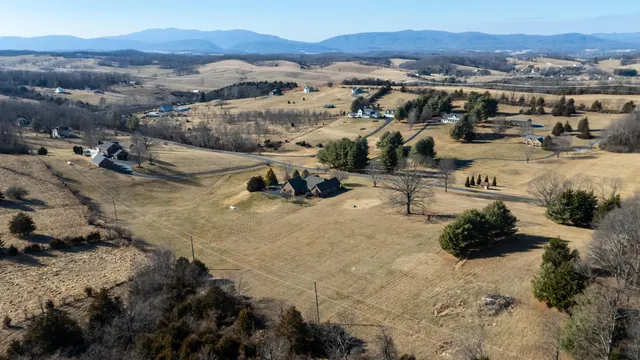 a bathroom with a toilet sink vanity and mirror