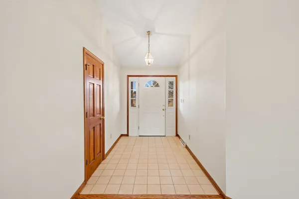 a kitchen with stainless steel appliances granite countertop a sink a stove and a wooden cabinets