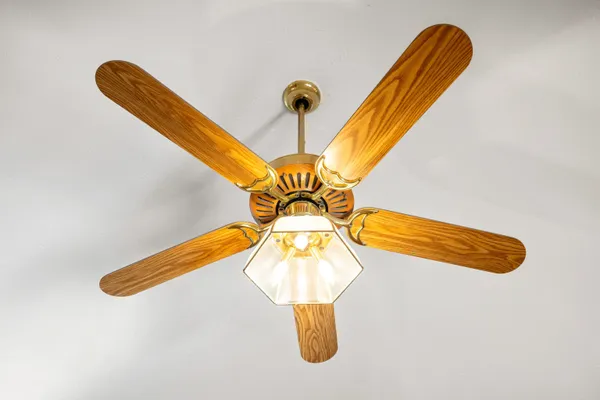 a living room with stainless steel appliances furniture and a view of kitchen
