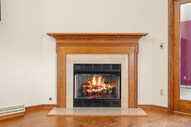 a room with pool table and window