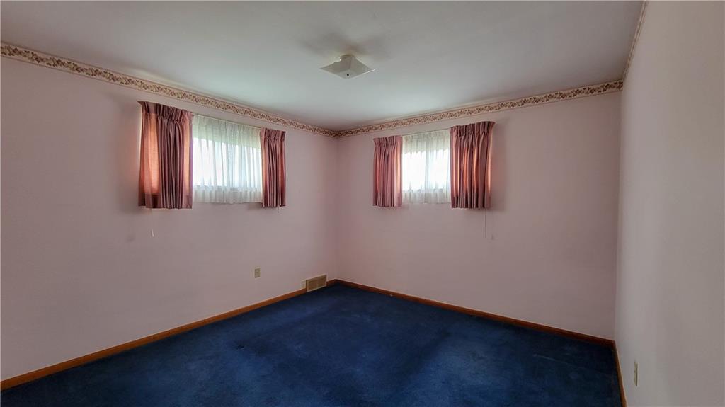 159 Crandon Circle Beaver, PA 15009 - Photo 8 of 13 an empty room with wooden floor and windows