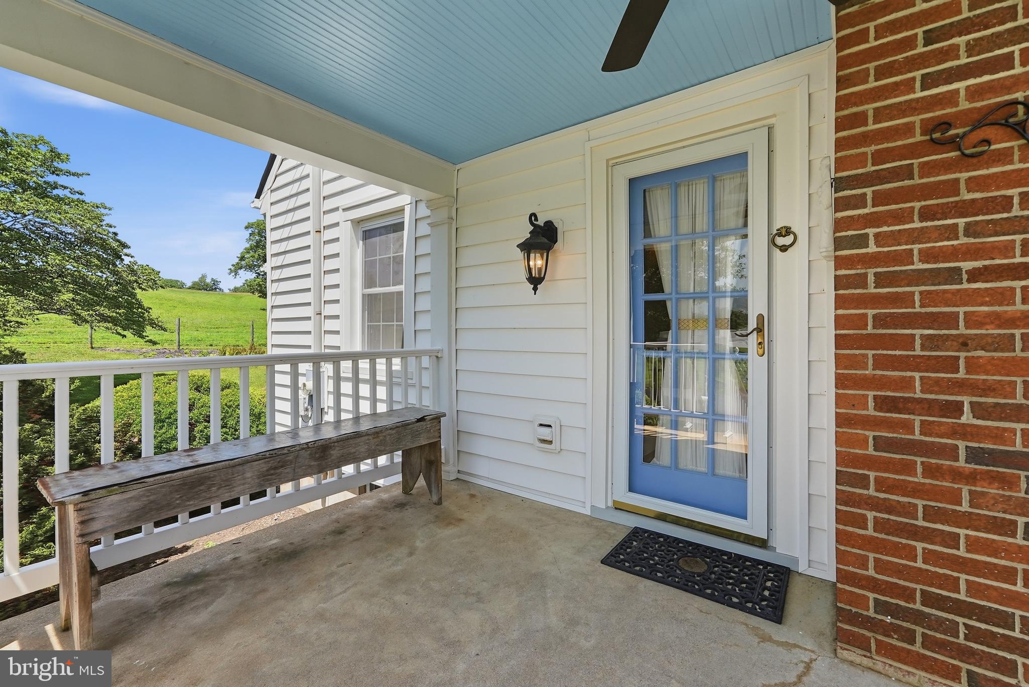 6117 South F T Valley Road Etlan, VA 22719 - Photo 8 of 36 Side porch leads in to the living room