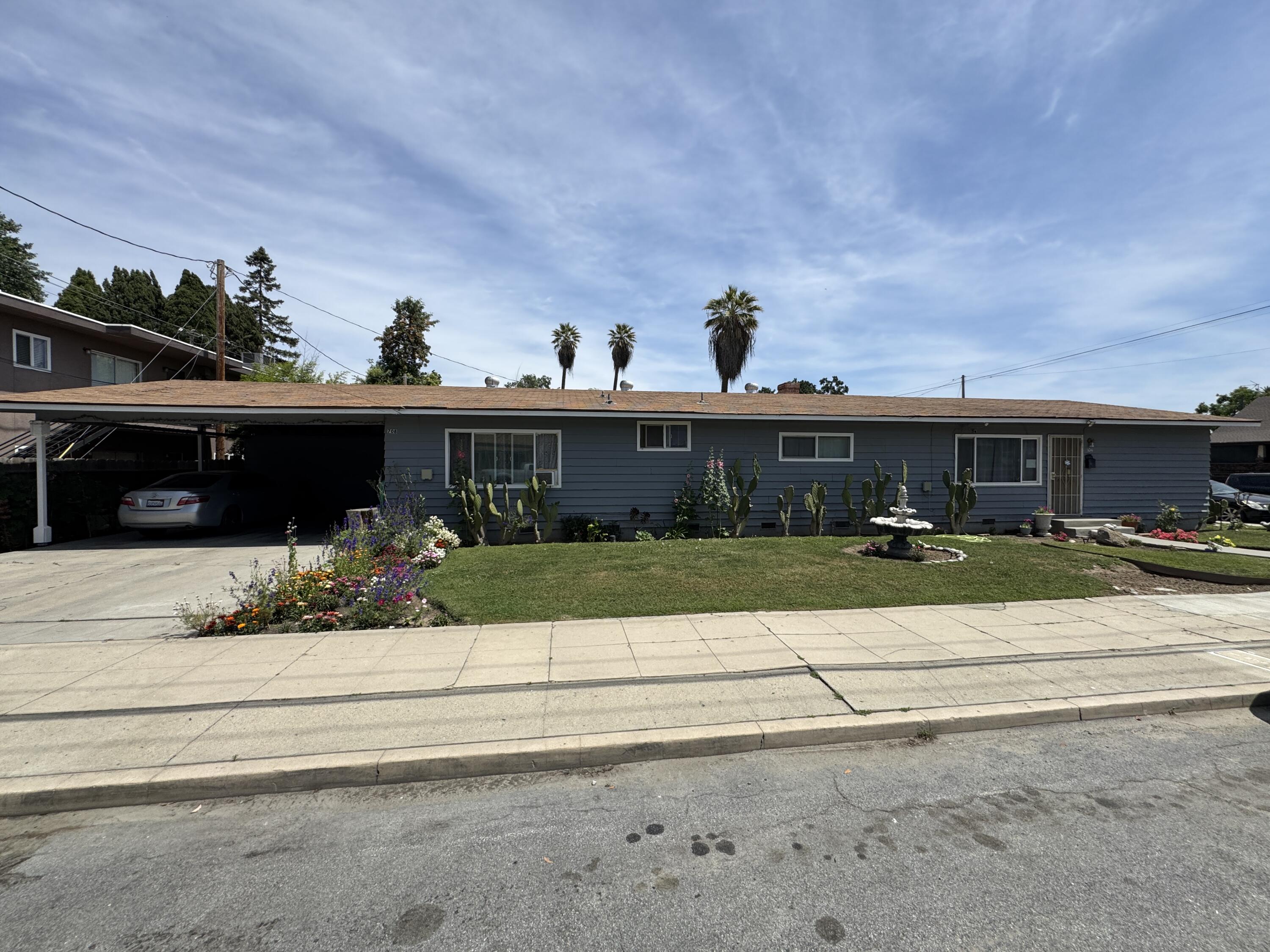 704 North Floral Street Visalia, CA 93291 - Photo 1 of 51 a front view of house with a yard