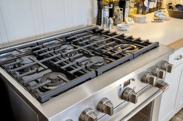 a stove sitting inside of a kitchen with stove