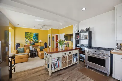a view of living room with furniture and flat screen tv