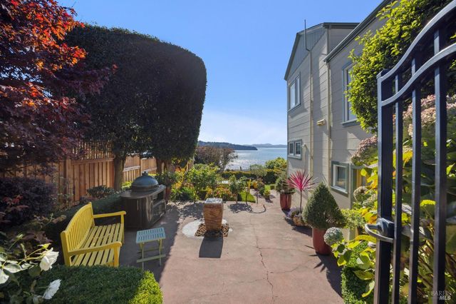a view of a chairs and table in the patio