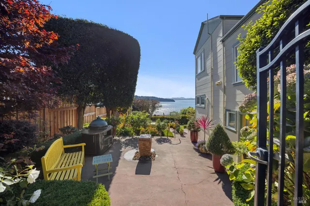 a view of a chairs and table in the patio