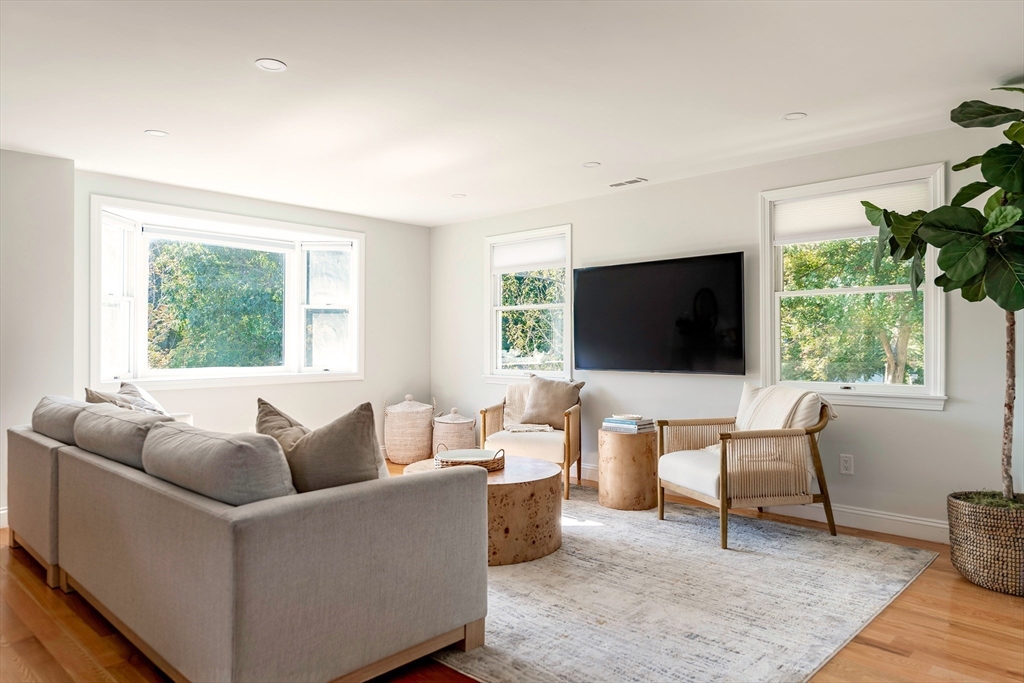 22 Sagamore Road Ipswich, MA 01938 - Photo 12 of 39 a living room with furniture and a flat screen tv