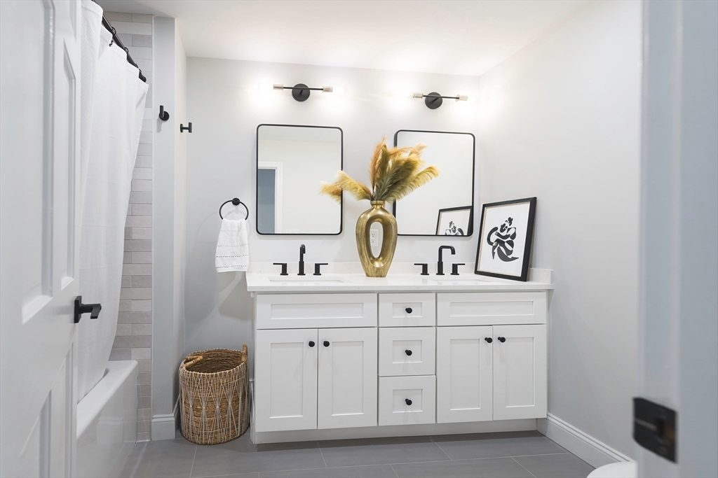 22 Sagamore Road Ipswich, MA 01938 - Photo 13 of 39 a bathroom with a double vanity sink