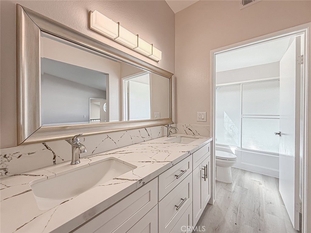 12392 Carl Street Pacoima, CA 91331 - Photo 32 of 55 a bathroom with a sink and a mirror