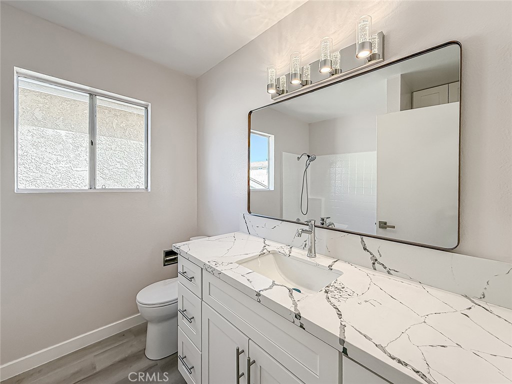 12392 Carl Street Pacoima, CA 91331 - Photo 42 of 55 a bathroom with a sink and a mirror