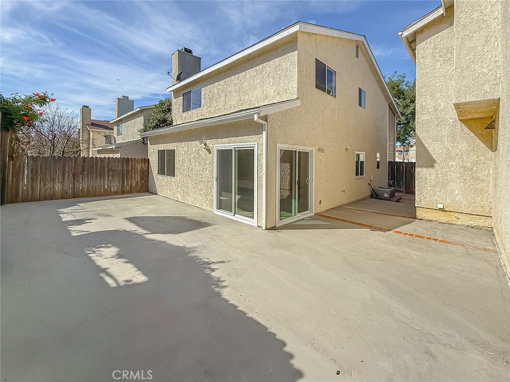 12392 Carl Street Pacoima, CA 91331 - Photo 50 of 55 a front view of a house with a garage