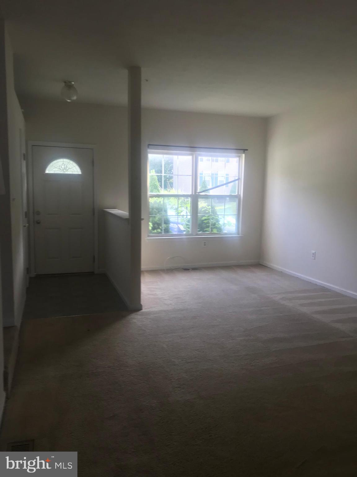 122 Cherry Tree Lane Elkton, MD 21921 - Photo 4 of 7 an empty room with windows