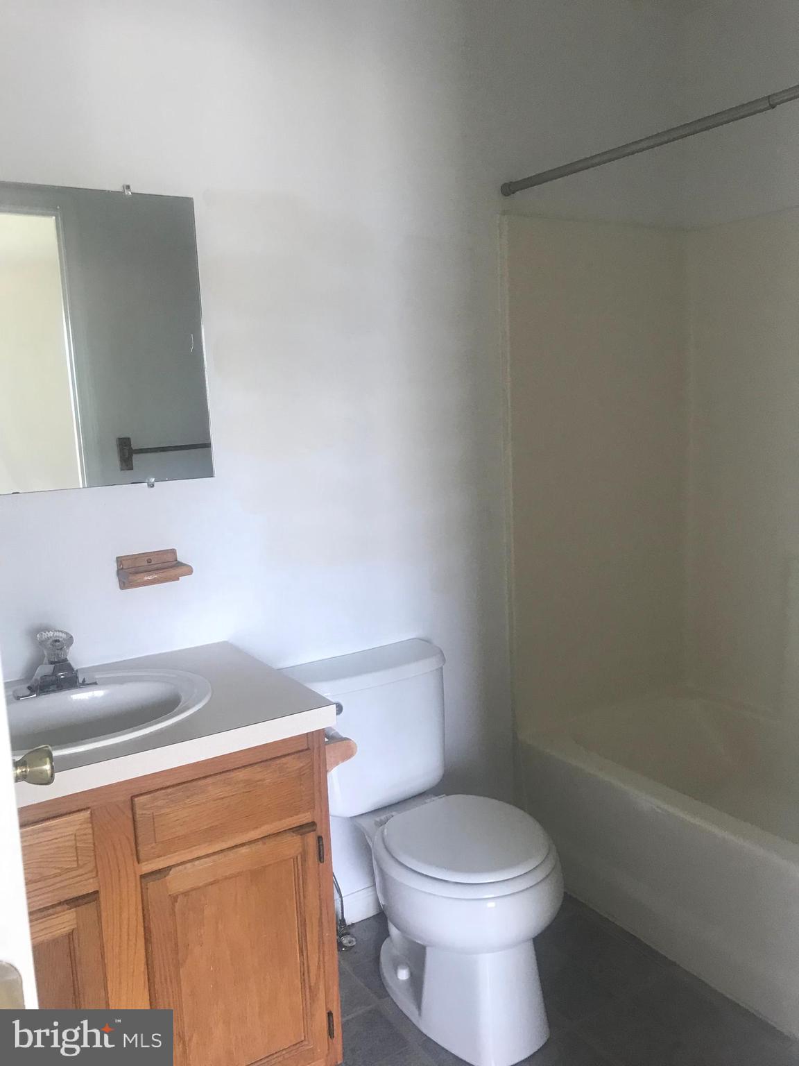 122 Cherry Tree Lane Elkton, MD 21921 - Photo 6 of 7 a bathroom with a toilet a sink and bathtub