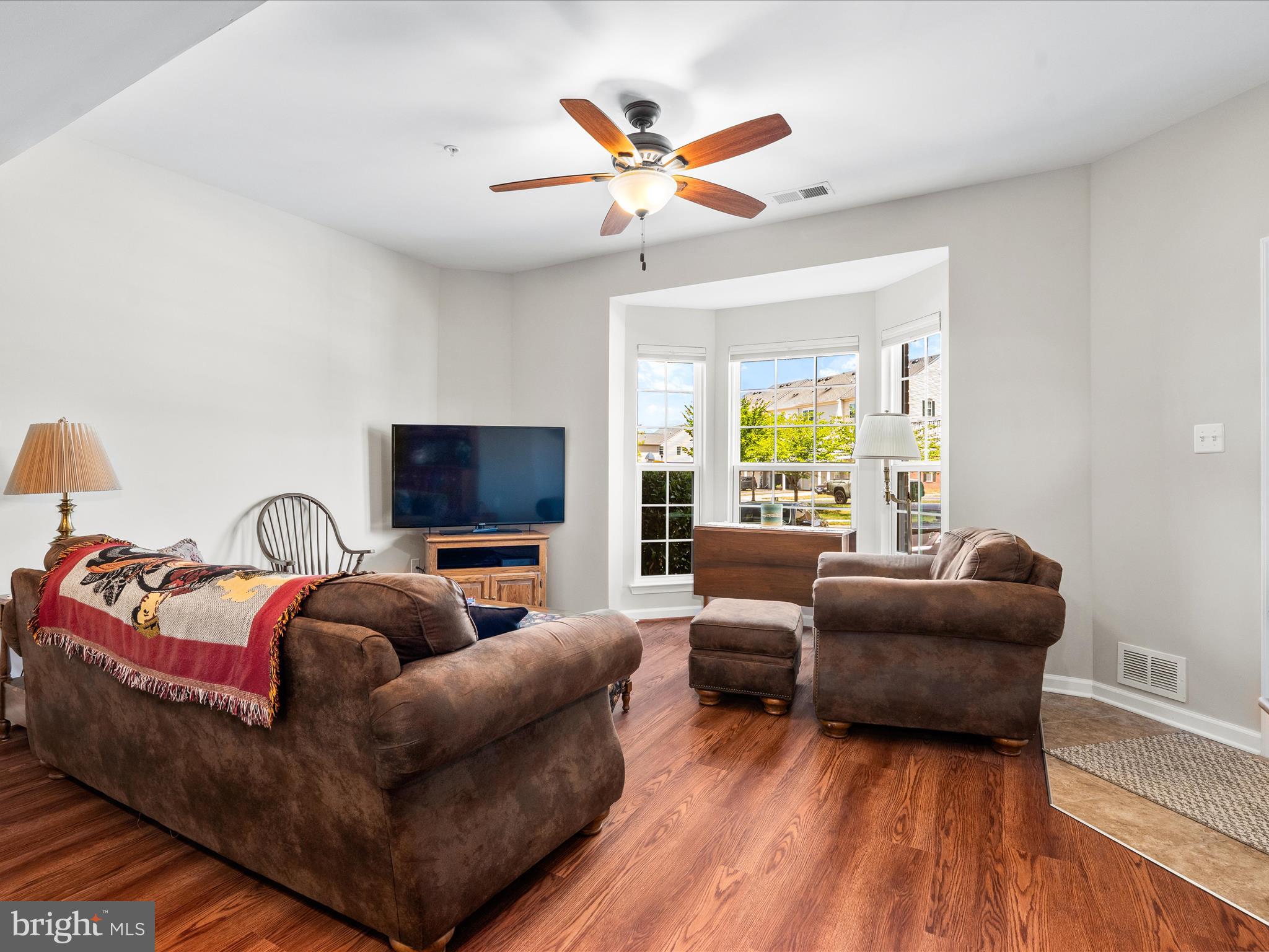 5039 Small Gains Way Frederick, MD 21703 - Photo 15 of 34 a living room with furniture and a flat screen tv