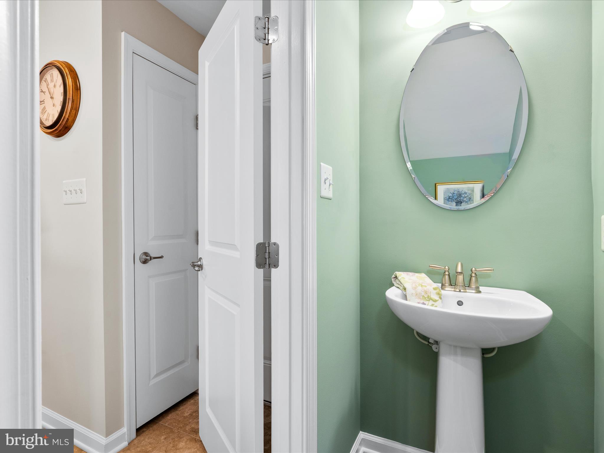 5039 Small Gains Way Frederick, MD 21703 - Photo 17 of 34 a bathroom with a sink and a mirror