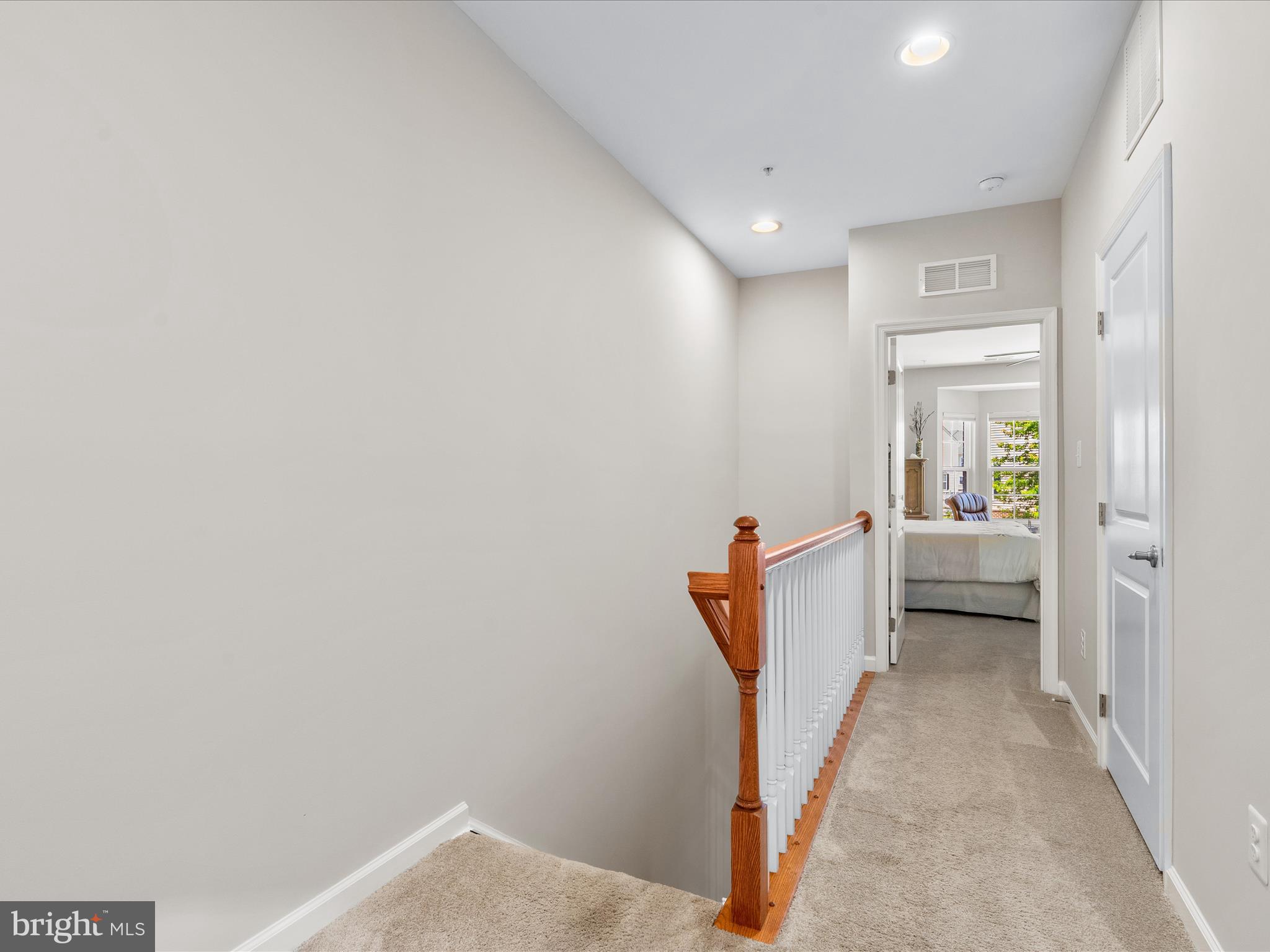 5039 Small Gains Way Frederick, MD 21703 - Photo 18 of 34 a view of a hallway with white walls