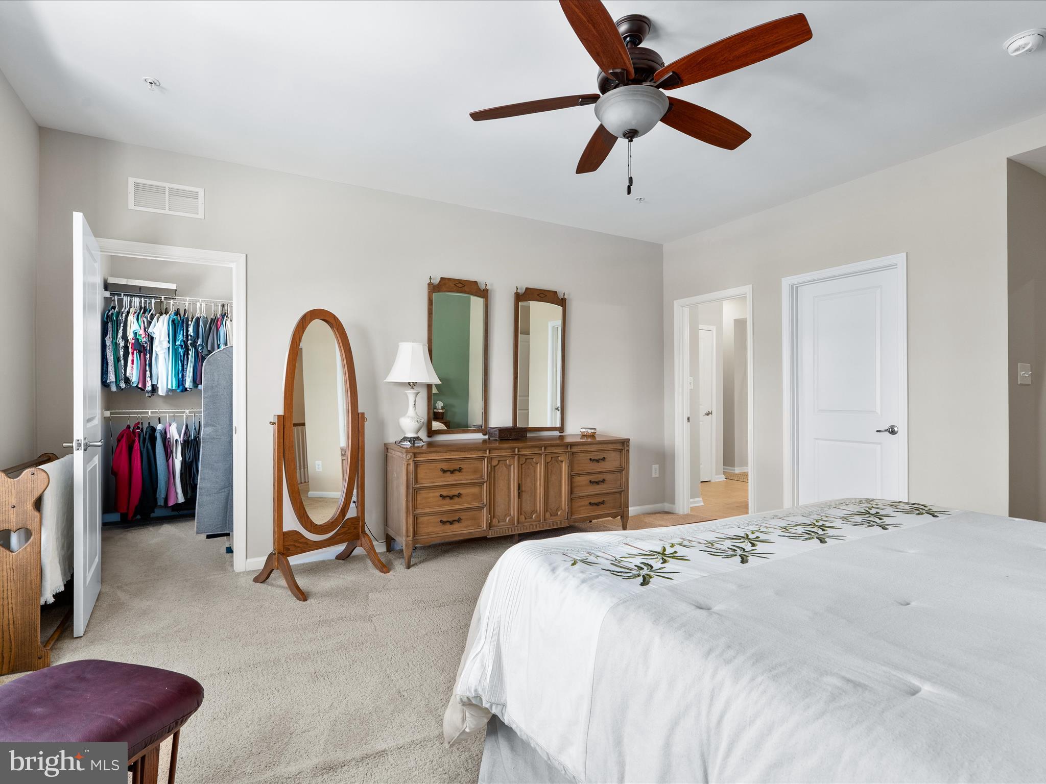 5039 Small Gains Way Frederick, MD 21703 - Photo 20 of 34 a bedroom with a bed a chandelier and dresser