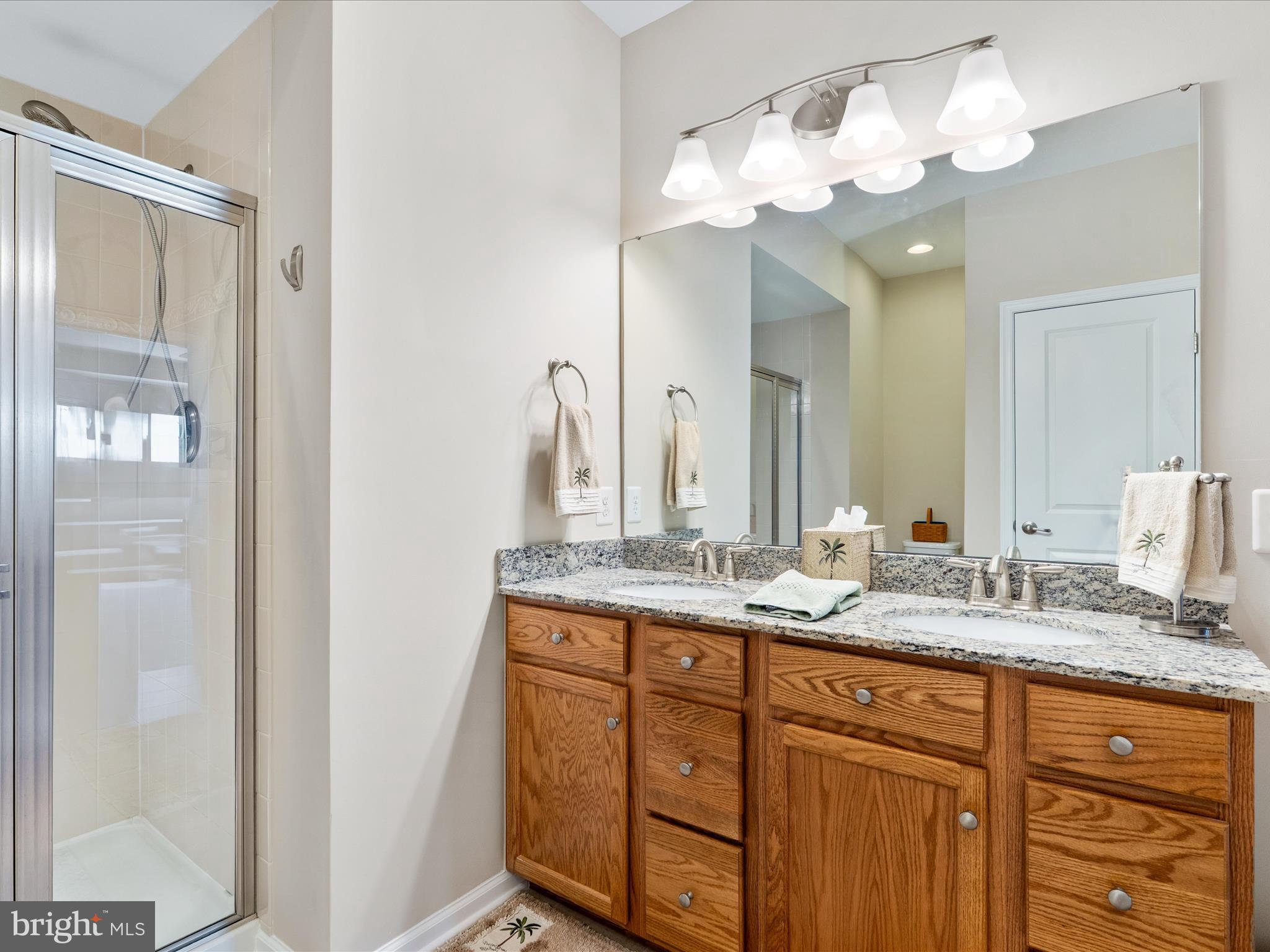 5039 Small Gains Way Frederick, MD 21703 - Photo 21 of 34 a bathroom with a granite countertop double vanity sink and a mirror
