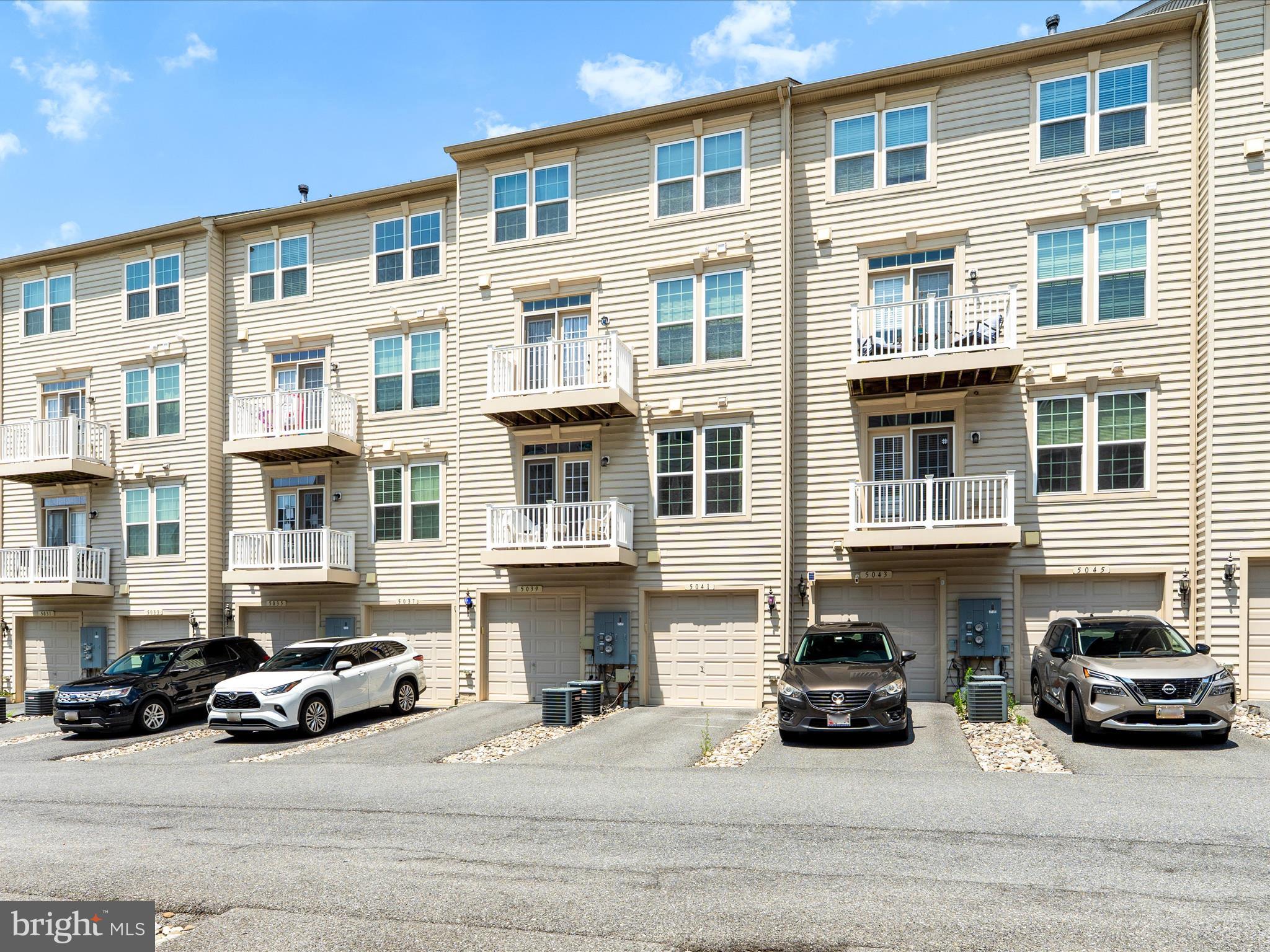 5039 Small Gains Way Frederick, MD 21703 - Photo 28 of 34 a car parked in front of a building