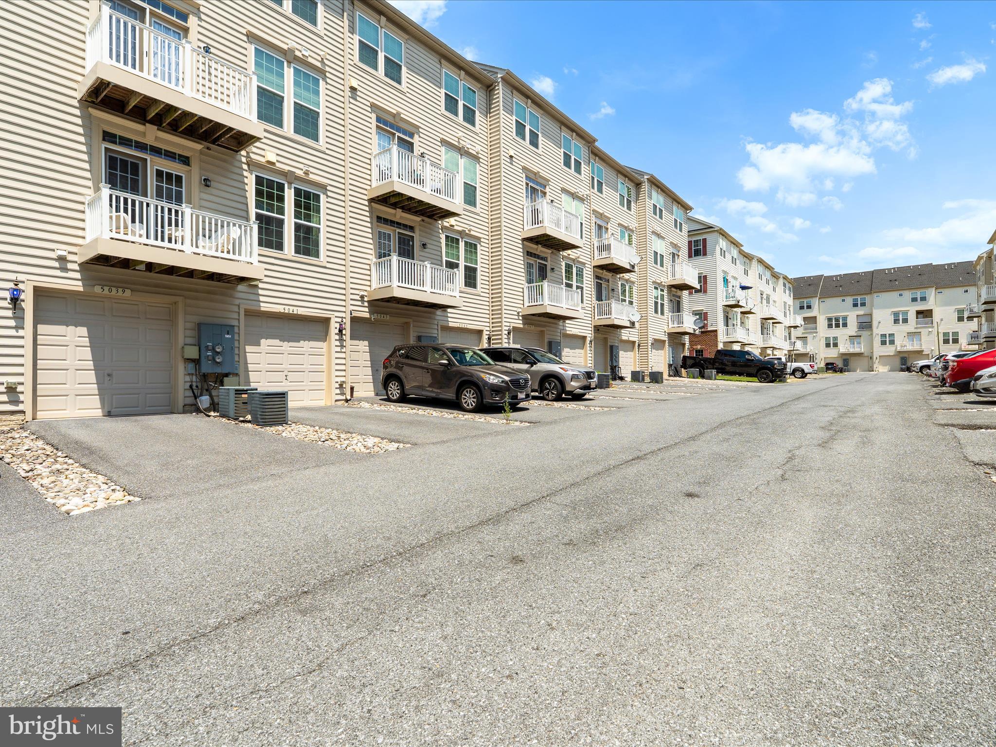 5039 Small Gains Way Frederick, MD 21703 - Photo 29 of 34 a car parked in front of a building